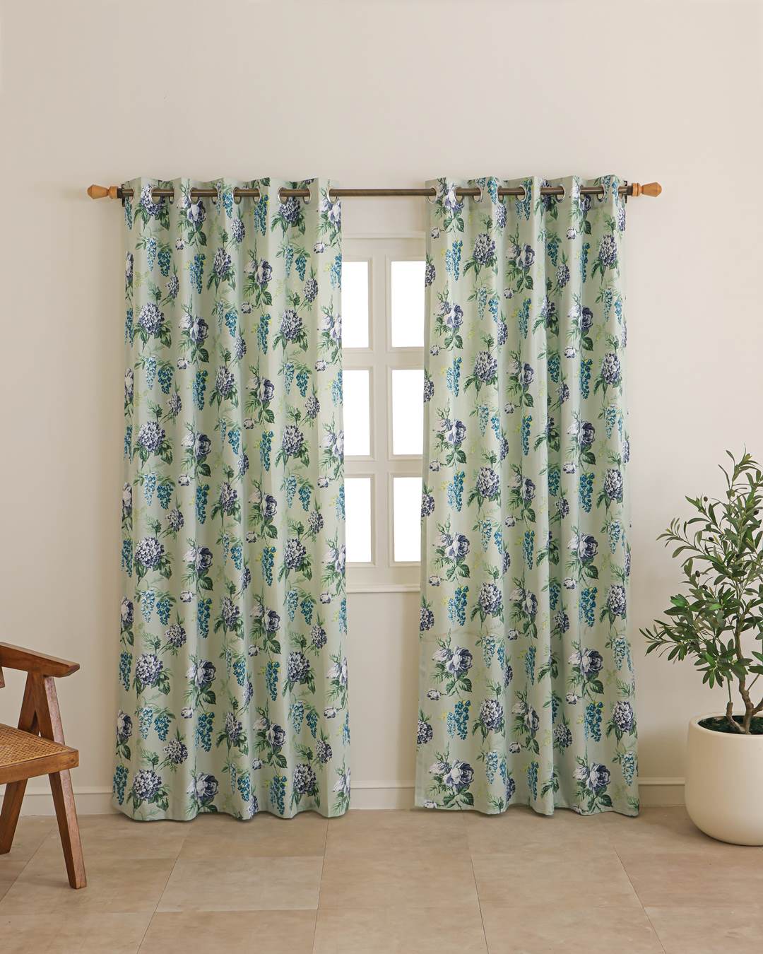 Close-up of sage green floral pattern on duck cotton curtain fabric