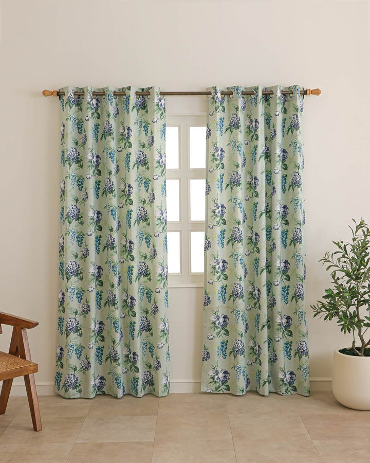 Close-up of sage green floral pattern on duck cotton curtain fabric