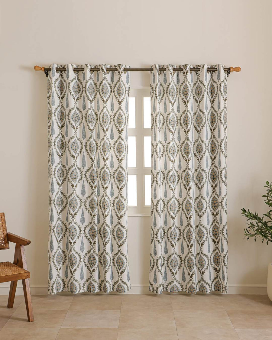 Detailed view of ivory vintage floral design on long door curtains