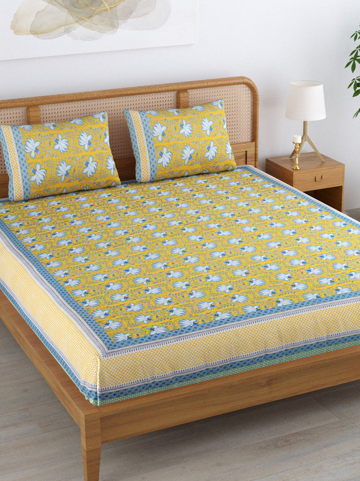 Cotton 220TC King Size Bedsheet With 2 Pillow Covers; White Blue Flowers On Yellow Base