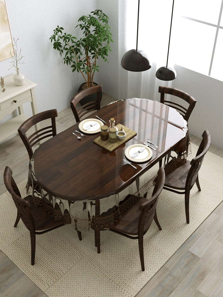 6 Seater Oval Anti Slip Transparent Dining Table Cover; 60x90 Inches; Material - PVC; Brown Tipping Lace