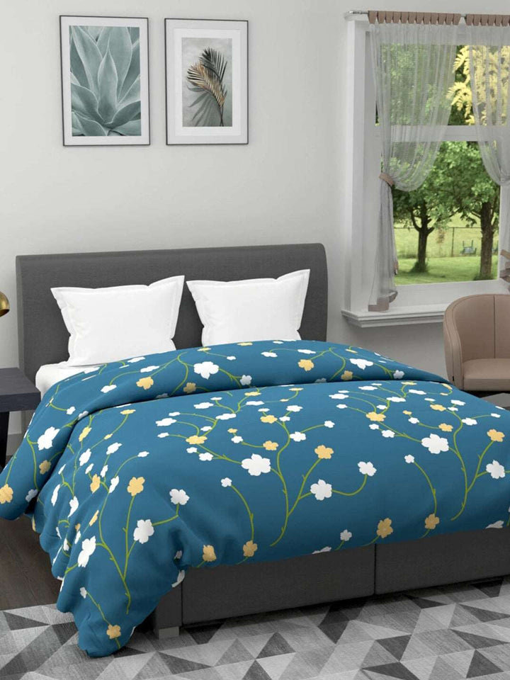 120 GSM All Weather Reversible Double Bed Quilt; 90x100 Inches; White & Yellow Small Flowers On Dark Blue Base